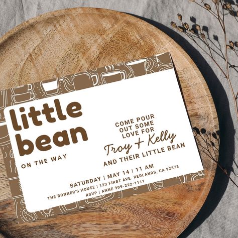 A little bean is on the way and it's time to pour out some love for the mom and dad-to-be! This espresso brown and white invitation with great coffee art around the edges and on the back is perfect for your coffee-loving friends who are about to become parents. Suitable for a mama-to-be or a couple's shower, have this cute invitation printed or digitally download it and get the coffee brewing! Gender Reveal Coffee Theme, Coffee Shop Baby Announcement, Baby Brewing Baby Shower Ideas, Coffee Shop Baby Shower Ideas, Coffee Baby Shower Theme, Baby Is Brewing Shower Ideas Coffee, Coffee Baby Shower Ideas, Baby Brewing Shower Ideas, Pregnancy Announcement Aesthetic