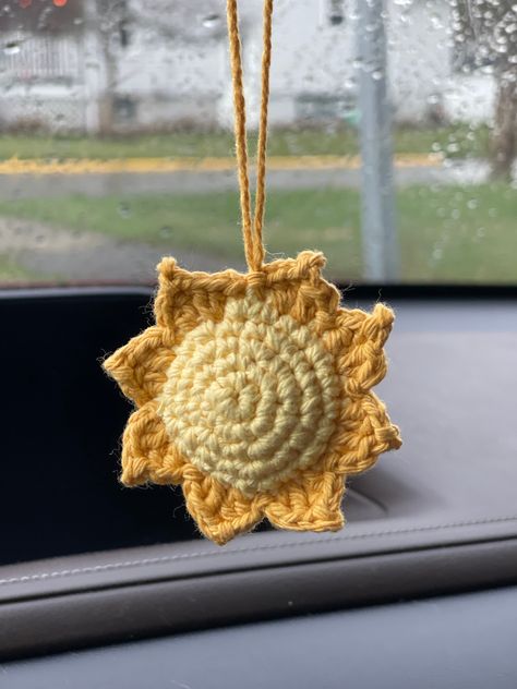 These adorable handmade crochet Sun ☀️ car hangers are crafted with care and attention to detail.  Ideal for any age driver who wants some Sunshine in their vehicle.  Cute gifts for her! Made with 100% cotton yarn and two different color yellows.  For any questions or concerns, please don't hesitate to contact me. I am here to assist you and ensure your complete satisfaction with your purchase! Dementions - Sun 2 1/2 X 2 1/2 Car Dangle Crochet, Rearview Mirror Crochet Patterns Free, Crochet Rear View Mirror Accessories, Crochet For Car Accessories, Car Mirror Hangers Crochet, Crochet Car Dangles, Crochet Car Hangers, Crochet For Car, Car Crochet Accessories