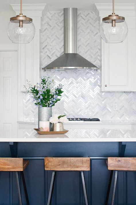 Transitional Kitchen With Navy Island White Traditional Cabinets And Gray Marble Herringbone Backsplash Tile Navy Island, Backsplash Marble, Kitchens White, Kitchen 2023, Texas Kitchen, Marble Herringbone, Island Hood, Hood Ideas, Kitchen Layouts