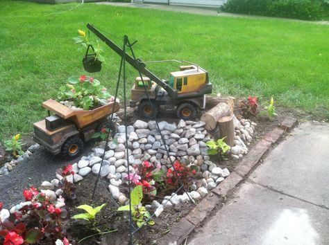 Tonka truck rock garden Garden Statuary, Tonka Trucks, Rock Quarries, Tonka Truck, Wedding Barn, Yard Work, Backyard Projects, Toy Trucks, Outdoor Ideas