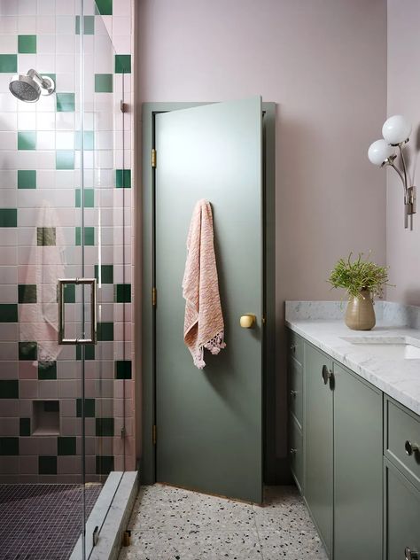 Geometric wallpaper and colorful tile mingle in this Austin, Texas, family home. Take a full tour at the link. Bathroom Green Vanity, Pink And Green Bathroom, Pink Tile Bathroom, Waterfall Island Kitchen, Green Bathroom Vanity, Pink Tile, Bathroom Green, Green Vanity, Bathroom Vanity Wall