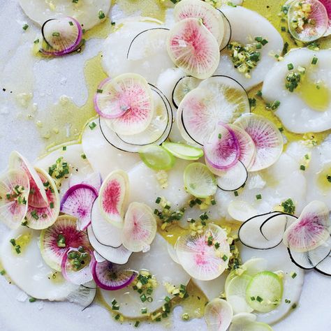 This simple and elegant raw scallop recipe gets flavor from fresh ginger, chives and fresh lime juice. Get the recipe at Food & Wine. Raw Scallops Recipe, Scallop Carpaccio, How To Cook Scallops, Grilled Scallops, Knife Skills, Quick And Easy Appetizers, Scallop Recipes, Scallops Seared, Pesto Recipe