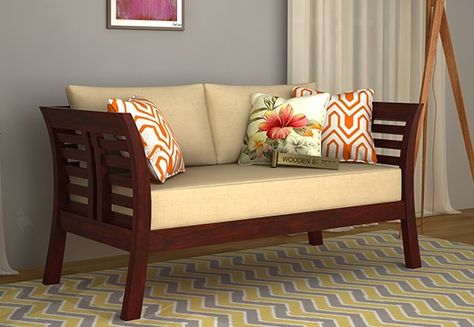 Simple and elegant this is how Darwin 2 Seater Wooden Sofa with beautiful Mahogany Finish can be introduced. Buy two seater sofa online for amazing living room set-up from the gorgeous 2 seater sofa designs at Wooden Street from #Noida #Chennai #Thane Family Area, Sofa Design Wood, Latest Sofa Designs, Wooden Sofa Set Designs, Indian Living Rooms, Wooden Sofa Designs, Wooden Street, Living Room Sofa Set, Wooden Sofa Set