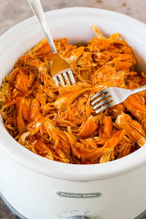 This crock pot buffalo chicken is chicken breasts cooked to tender perfection in a mixture of hot sauce, ranch seasoning and butter. Shred this slow cooker chicken and serve it as-is, on a sandwich or as a salad topper. Barbeque Chicken Recipes, Bbq Chicken Recipe, Braised Chicken Breast, Barbecue Chicken Recipe, Bbq Chicken Breast, Slow Cooker Bbq Chicken, Slow Cooker Bbq, Bbq Chicken Recipes, Crockpot Recipes Beef