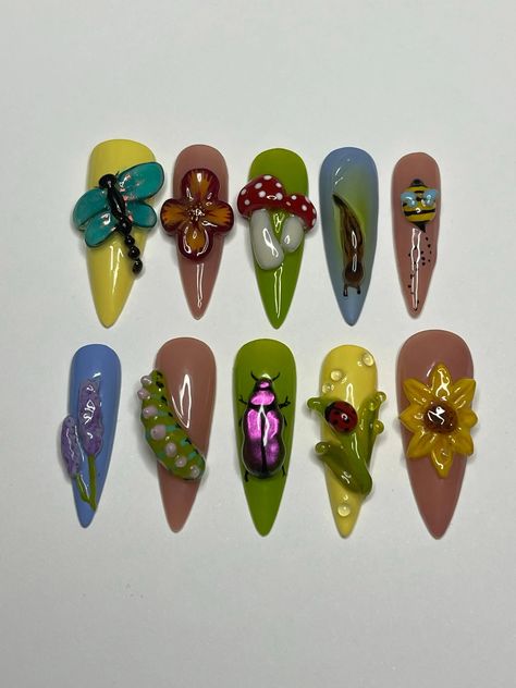 Explore our 3D Lively Garden Fake Nails, crafted with a charming handmade design of flowers and bugs. Available in short and long lengths, these vibrant nails add a whimsical touch to your look. Perfect for those who appreciate unique, glue-on false nails that stand out with creativity. 📦 What comes with your press on nail kit? 10 nails of your size 24 adhesive tabs 1 nail file 1 cuticle stick Instructions on how to apply and remove them. Finding Your Size:Check out our sizing chart or Visit ou Green Theme Nails, Vegetable Nails, Plant Nails Design, Caterpillar Nails, Fairy Garden Nails, Junk Nail Designs, Patch Nails, Dragonfly Nails, Quirky Nails