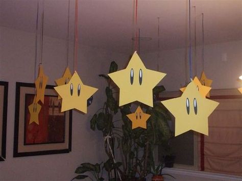 Super Mario Birthday Party DIY Decoration Ideas.  Stars hung from the ceiling. Princess Peach Party, Mario Kart Party, Mario Und Luigi, Mario Bros Birthday Party Ideas, Nintendo Party, Super Mario Bros Birthday Party, Mario E Luigi, Birthday Party Table Decorations, Super Mario Bros Party