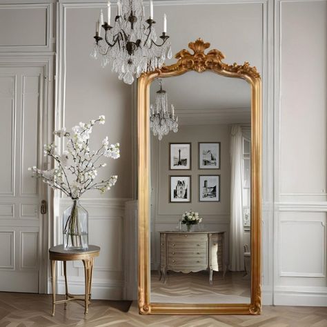 Explore timeless elegance with our Jardinière floor mirror, perfect for your living room, bathroom, or bedroom. This 6.5-foot gilt gold mirror, inspired by Rococo style, exudes French sophistication. Hand-carved with intricate detail, its antique reproduction adds historic elegance to any space. Ideal for grand foyers, luxurious living rooms, or elegant bedrooms, this mirror becomes a captivating focal point. PRODUCT DETAILS ------------------------ ✔ Dimensions: 79 inches (H) x 35 inches (W) ✔ French Gold Mirror, Entryway Decor High Ceiling, French Interior Bathroom, Big Mirror Bedroom, Standing Mirror Living Room, Booktok Room, Mirror On Fireplace Mantel, Victorian Style Bedroom, Antique Floor Mirror