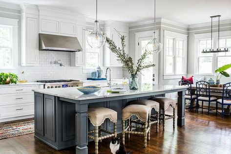 Four beige burlap abacus stools sit at a charcoal gray island topped with a white and gray marble countertop fitted with a sink and lit by Kichler Pendants. Modern Contemporary Kitchen Design, Island With Sink, Hgtv Kitchens, Contemporary Style Kitchen, Kitchen Island With Sink, Modern Contemporary Kitchen, Kitchen Island With Seating, Best Kitchen Designs, Kitchen Design Trends