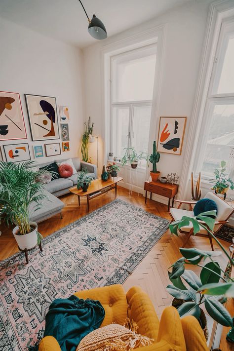 Prints and paintings by Jan Skacelik decorate this large mid-century boho living room #artwork #painting #interiordesign #midcentury Jan Skacelik, Mid Century Boho Living Room, Boho Apartments, Lots Of Plants, Interior Boho, Elegant Living Room Design, 아파트 인테리어, Modern Houses Interior, Vintage Living Room