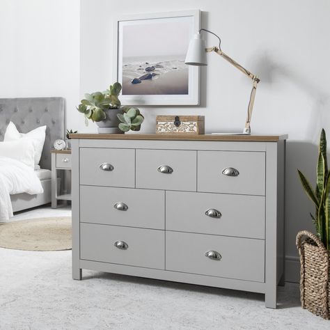 This fantastic 3 over 4 drawer chest provides all the drawer space you'll need for your bedroom. Its versatility means it can be used in the living room, dining room and can double as a sideboard or storage chest. Simple yet elegant, the clean lines will be a beautiful and practical addition to any décor. With an oak effect, top and metal cup handles finishing the look this classic design will complement any room. Grey Wardrobe, Bedside Table Grey, Tallboy Chest Of Drawers, Large Chest Of Drawers, Laura James, Drawers Bedroom, 4 Drawer Chest, Bedroom Chest Of Drawers, White Bedside Table