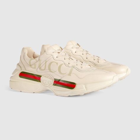 Shop the Rhyton Gucci logo leather sneaker by Gucci. Designed with a thick sole and bulky construction, the sneaker has a retro influence in leather with a vintage Gucci logo inspired by prints from the 1980s. Gucci Rhyton Sneakers, Tenis Gucci, Gucci Rhyton, Mens Sport Sneakers, Dad Shoe, Givenchy Tshirt, Louboutin Bags, Burberry T Shirt, Gucci Vintage