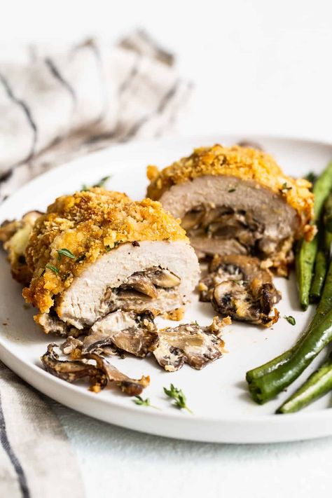 These stuffed pork chops are crunchy on the outside and packed with cheesy mushroom goodness on the inside making these the ultimate weeknight meal. Cheese Stuffed Pork Chops, Baked Stuffed Pork Chops, Slow Roasted Pork Shoulder, Stuffed Pork Chops, Mushroom Stuffed, Pork Shoulder Recipes, Pork Seasoning, Fit Foodie Finds, Cheese Stuffed Chicken Breast