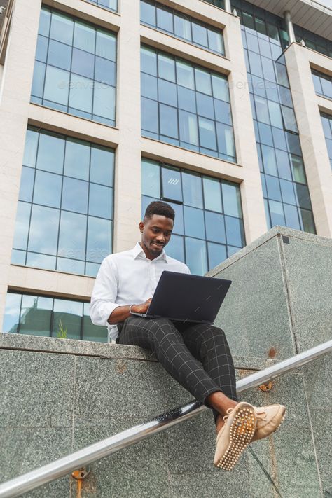 Handsome young businessman working with laptop outdoors at business building by Vladdeep. Handsome young businessman working with laptop outdoors near business building. #Sponsored #businessman, #working, #Handsome, #young Laptop Photography, Working With Laptop, Business Photoshoot, Personal Branding Photoshoot, Senior Pictures Boys, Men Photoshoot, Outdoor Photoshoot, Outdoor Photos, Business Photos