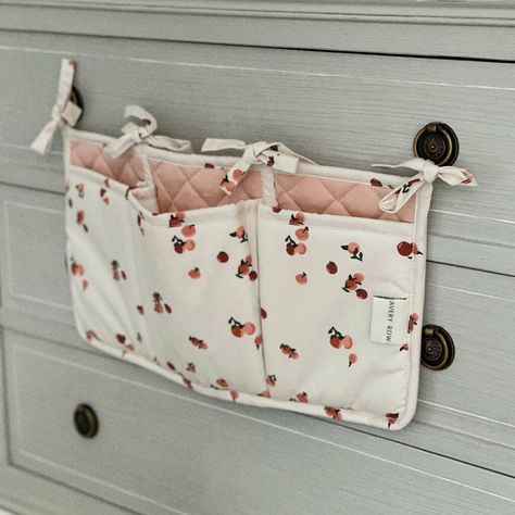 Cot Organiser Pockets Peaches By Avery Row | notonthehighstreet.com Bed Pocket, Nursery Crafts, Tie Quilt, Baby Cot, Baby Bed, Diy Inspiration, Childrens Room, Peaches, Kid Room Decor