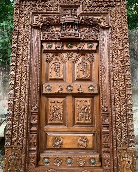 Teak wood intricate carved entrance door of Tamil Nadu style. Door Images Wooden, Main Entrance Door Design Teak Wood, Main Door Teak Wood Design Entrance, Carved Doors Wooden, Main Door Carving Design Entrance, Teak Wood Main Door Design Entrance Indian, Carving Door Design, Teak Wood Main Door, Wood Main Door