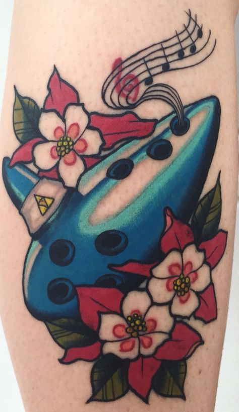 Ocarina Tattoo, Ocarina Of Time Tattoo Ideas, Legend Of Zelda Ocarina Of Time Tattoo, Traditional Zelda Tattoo, Ocarina Of Time Tattoo, Zelda Ocarina Of Time Tattoo, Zelda Tattoo Ideas Ocarina Of Times, Zelda Triforce Tattoo Ideas, Zelda Silent Princess Flower Tattoo