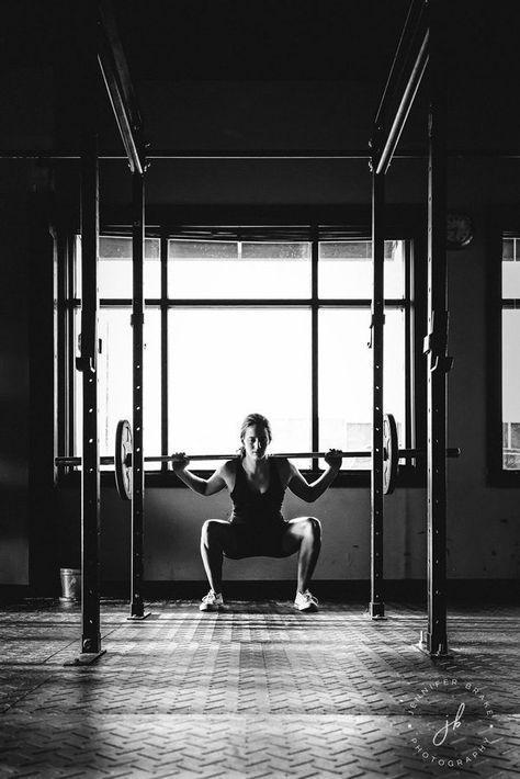 Black and white photograph of a woman doing a barbell squat in a downtown gym. #jenniferbrakephotography #southbendphotographer #barbell #squat #fitness #fitnessphotography #grit #weighlifting #monochrome #blackandwhite #blackandwhitephotography Fitness Portrait, Gym Photoshoot, Gym Photography, Barbell Squat, Gym Photos, Back Squats, Fitness Photoshoot, Sports Arena, Black And White Photograph