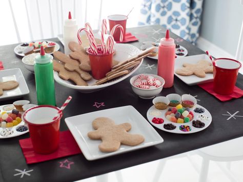 Keep the kids entertained with their own party activity. Set up a gingerbread decorating station, complete with to-go boxes so little ones take the treats with them when they leave. >> http://www.hgtv.com/design/make-and-celebrate/holidays/kids-gingerbread-cookie-decorating-party-pictures?soc=holidaypinparty Gingerbread Cookie Decorating, Kids Gingerbread House, Cookie Decorating Station, Christmas Cookie Party, Gingerbread House Parties, Gingerbread Party, Ultimate Cookies, Cookie Decorating Party, Decorating Party