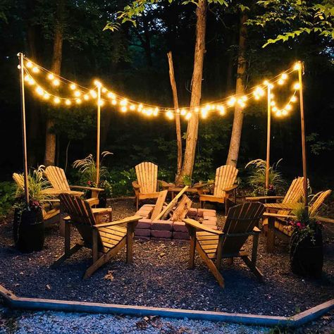 12 Outdoor Fire Pit Lighting Ideas | The Family Handyman Fire Pit Lighting Ideas, Outdoor Fire Pit Area, Bonfire Pits, Rustic Fire Pits, Cedar Posts, Fire Pit Lighting, Diy String Lights, Fire Pit Landscaping, Fire Pit Area