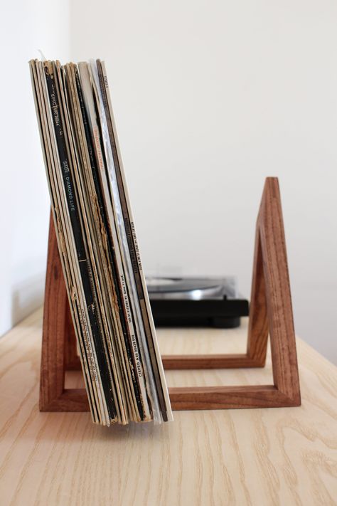 Our favorite wooden vinyl record stand features a compact size and minimalist design. Thanks to this, the stand does not require much space for placement and is very convenient to use, and it is also easy to keep vinyl records organized with it. Ash wood vinyl stand available in 4 colors: natural, dark, white and black. MATERIALS: Dark stand: ash wood, covered with colored oil-wax from OSMO. Natural stand: ash wood, covered with transparent oil-wax from OSMO. Black stand: ash wood, covered with black paint. White stand: ash wood, covered with white paint. EXTERNAL DIMENSIONS: Length 26.5 cm (Inner dimensions 22 cm) Width 17 cm Height 25.5 cm Records Stand, Vinyl Record Organization, Vinyl Stand, Vinyl Record Furniture, Vinyl Record Cabinet, Record Organizer, Raw Wood Furniture, Vinyl Record Stand, Vinyl Record Holder