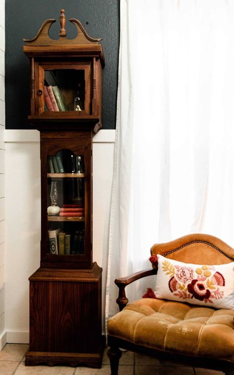 This gorgeous handmade antique grandfather clock was sitting sadly at a thrift store with a $10 clearance tag. It took a single afternoon to convert it into this beautiful bookcase. If you're looking for a great idea on how to repurpose an old grandfather clock into an eclectic conversational piece, I have some great ideas to share with you! #grandfatherclock #DIYProjects #RepurposingProject Old Grandfather Clock Ideas, Repurpose Grandfather Clock, Diy Grandfather Clock, Dollhouse Inside, Old Grandfather Clock, Repurposed Grandfather Clock, Clock Makeover, Grandmother Clock, Antique Grandfather Clock