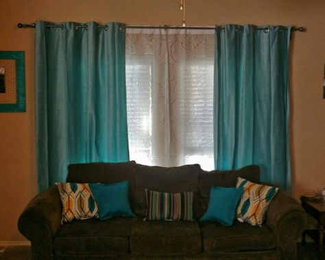 My New Living Room Curtains. I love them! Light Turquoise Curtains - Ikea Sanela. Decorative Couch Pillows - Anna's Linens. Brown Couch - Rooms To Go but I don't suggest buying furniture from them. I can't wait to get a new couch. Turquoise Drapes Living Room, Teal Sofa Living Room Curtains, Brown Sofa Teal Curtains, Brown Chair Living Room, Ikea Turquoise Curtains, Brown Sofa Set, Turquoise Curtains, Torqouise Sofa, Teal Curtains