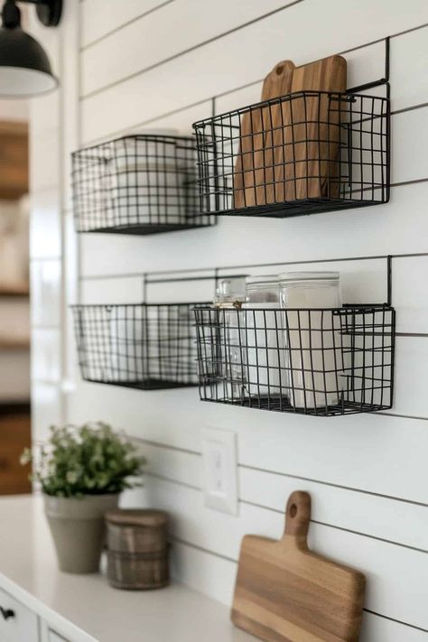 Stylish geometric wire baskets mounted on a rustic farmhouse kitchen wall for decorative storage. Kitchen Wall Baskets, Wall Storage Ideas Kitchen, Wire Basket Decor Kitchen, Basket Decor Kitchen, Farmhouse Kitchen Wall Colors, Wall Grid Ideas, Wall Decor Ideas Farmhouse, Wire Basket Decor, Farmhouse Kitchen Wall Art