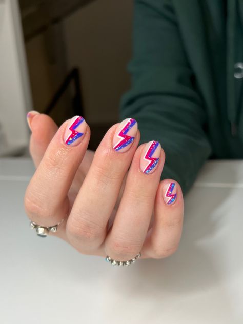 nail inspo, nail designs, acrylics, nail ideas, trendy nail art, nail art, edgy nails, nail instagram story idea, nail picture, short nail designs, lightning bolt nails, colorful nail designs, pink nails, pink nail design, purple nail designs, freestyle nails, sparkly nails, short pink nails, rock n roll nail art, round nails, round nail inspo, almond nail designs, sparkle nails, glitter nail ideas, edgy nail design, edgy nail art, ethereal nail, fairy nails Edgy Nail Designs Short, Rock Band Nail Designs, Purple Nails With Lightning Bolt, Lightning Nails Short, Rock N Roll Nail Art, Rock Music Nails, Nails For Rock Concert, Fun Concert Nails, Music Festival Nail Ideas