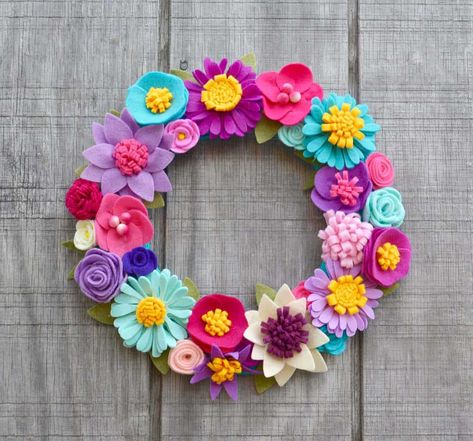 I love this collection of 100 Bright & Colorful Spring Wreaths for yoru Farmhouse Front Door. Decorate your home with bright and cheerful colors of pink, orange, yellow, green and not as muted pastels. Use neon colors. Add in mesh, lambs ear, paper, tulips, other flowers. DIY and dollar store ideas to do it yourself or buy these and put them up right away. #frontdoordecor #frontdoorwreath #springwreaths #easterwreaths #brightspringwreath Pinecone Flowers, Felt Flower Wreath, Paper Flower Wreaths, Felt Flower Wreaths, Crochet Wreath, Floral Grapevine, Colorful Wreath, Purple Wreath, Pom Pom Wreath