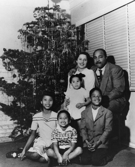 African American family posing in front of the Christmas tree at their home,  Los Angeles, 1950. Family Photoshoot Outfits Black, Family Of 3 Christmas Pictures, Family Holiday Aesthetic, African American Christmas, Christmas Family Photoshoot, African American Family, Holiday Aesthetic, Family Photoshoot Outfits, Black Family