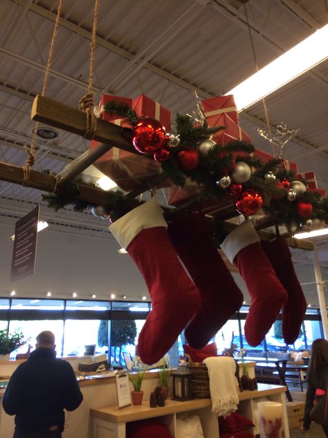 Hanging ladder display Stocking Stuffer Display Retail, Ladder Christmas Decor, Christmas Stocking Stand, Christmas Shop Displays, Stocking Stand, Ladder Christmas Tree, Antique Ladder, Christmas Ceiling Decorations, Hanging Ladder