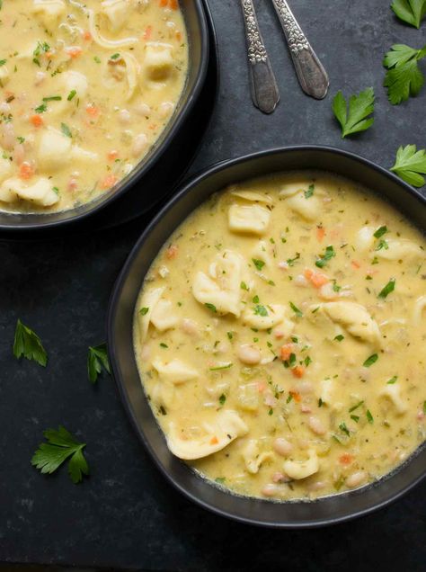 A one-pot soup that's big on flavor and low on effort, Creamy White Bean Tortellini Soup is weeknight easy but weekend flavorful! Recipe at SoupAddict.com #soup #pasta Low Fat Soups, Soup Pasta, Northern Beans, Great Northern Beans, Tortellini Soup, Soup Season, White Bean, Fresh Pasta, Healthy Soup Recipes