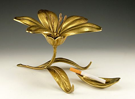 A unique floral ashtray dispenser from the Art Deco era. Flower Ashtray, Conic Section, Puff The Magic Dragon, Metal Flower, Art Deco Era, Ashtrays, Metal Flowers, Under Construction, Art Nouveau