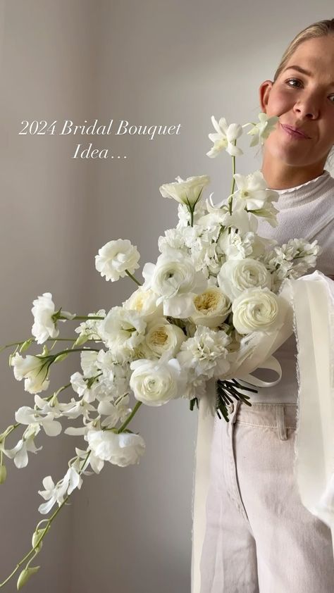 Morgan Cullimore┋ Florist | ✨2024 Bridal Bouquet Inspo ✨ The classic, all white bouquet … with a slight cascade ;) What do we think?!? 🤩 anyone doing white for… | Instagram Horizontal Bridal Bouquet, White Ohara Rose Bouquet, Big White Bridal Bouquet, Summer White Wedding Flowers, Unique White Bridal Bouquet, Big White Bouquet, Flower Bouquet Wedding White, Diy White Rose Bouquet, Bride Bouquets Cascade