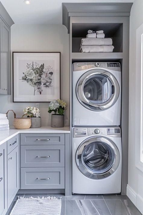 The Compact Urban Laundry Nook transforms a small corner into a fully functional laundry area, using a stacked washer and dryer to maximize floor space. This setup is ideal for urban dwellers with limited space, incorporating streamlined storage solutions that blend seamlessly with other urban decor elements. The use of bright, light-reflecting colors enhances the sense of space, making this stacked laundry room feel larger than it is. Functional lighting and minimalistic design help maintain Laundry Room Layout Stacked Washer Dryer, Mudroom Stacked Washer Dryer, Small L Shaped Laundry Room, Stacked Washer And Dryer Laundry Room, Laundry Corner Ideas, Laundry Room With Bench, Double Stacked Washer And Dryer, Laundry Room With Stackable Washer Dryer, Stackable Washer Dryer Laundry Room