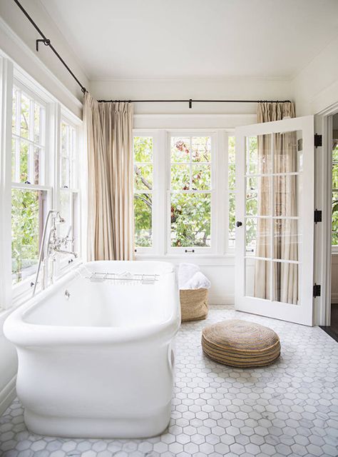 Bathroom spacious enough to accommodate a freestanding bathtub in a separate room filled with large openingsImage by Brittany Ambridge via Domino Hamptons Beach House, Hexagon Tile Floor, Bad Inspiration, Subway Tiles, Dream Bathrooms, Bathroom Floor Tiles, Bath Tub, Style At Home, Beautiful Bathrooms