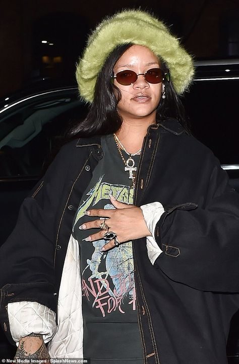 Looking good: The singer, 31, commanded attention as she borrowed style tips from the early 00s in a fluffy green bucket hat, teamed with a Metallica T-shirt Fluffy Bucket Hat Outfit, Fuzzy Bucket Hat Outfit, Rihanna Baby, Fuzzy Hat, Fluffy Hat, Bucket Hat Outfit, Fuzzy Bucket Hat, Fluffy Bucket Hat, Metallica T Shirt