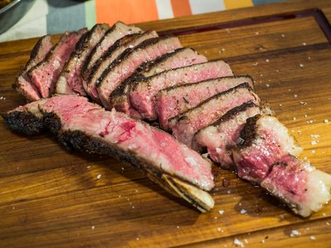 Reverse Seared Ribeye Recipe | Jeff Mauro | This photo is horrible, but the technique is supposed to be foolproof.  His steak was 2" thick, and this method works best on the thick steaks.  Also they mentioned that it is good to salt the raw steak on the rack and then put in the fridge overnight, uncovered, to dry out.  Cook the next day. Rib Eye Recipes, Seared Salmon Recipes, Jeff Mauro, The Kitchen Food Network, Chimichurri Recipe, Rib Eye, Alton Brown, Seared Steak, Pan Seared Salmon