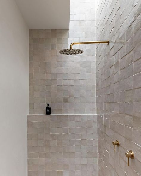 HAAUS.® on Instagram: "Our HAAUS.5 ensuite bathroom is definitely a space you walk into and instantly feel a sense of calm. Zellige tiles paired with brushed brass fixtures = simplicity and elegance in every detail. ✨   The addition of a skylight elevates the ambiance, casting a serene glow over the textures. Who wouldn’t want to shower in here! 😍  Create the Look ~ Wall Tiles: @ambertiles Zellige Ecru Terracotta Moroccan Square Gloss ~ Wall Tile Grout: @ardexaustralia FG8 #248 in Walnut from @ambertiles  ~ Shower Head: @adpaustralia Soul Rain Shower Rose Brushed Brass ~ Shower Arm: @adpaustralia Soul Shower Arm 450mm in Brushed Brass ~ Mixer: @adpaustralia Soul Grove Wall Mixer in Brushed Brass ~ Shampoo: @leifproducts Blue Cypress Shampoo ~ Floor Tiles: @ambertiles Cavestone Sahara 600 Square Tile Bathroom, Zellige Tiles, Space Saving Bathroom, Shower Rose, Stone Bathroom, Stunning Bathrooms, Brass Shower, Zellige Tile, Ensuite Bathroom