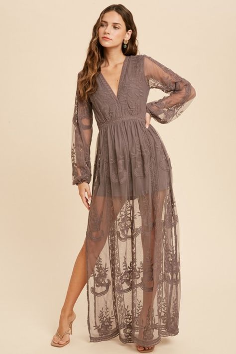 The Elegant Romance Long Sleeve Lace Maxi Romper Dress is the perfect bohemian-inspired mesh lace maxi romper dress. Be the best-dressed wedding guest, boho bride, or event attendee in this beautiful floral embroidered lacey maxi dress complete with lined shorts for a beautiful romper vibe. Perfect for photoshoots, this Deep V-neckline dress features no front hook eye closure, side slits, and hidden back zipper closure. Front + Shorts lining, long sleeves/cap sleeve maxi dress. Model is wearing Lace Maxi Romper, Maxi Romper Dress, Bohemian Rompers, Maxi Romper, Embroidered Maxi Dress, Boho Lace, Lace Dress Long, Necklines For Dresses, Lace Maxi