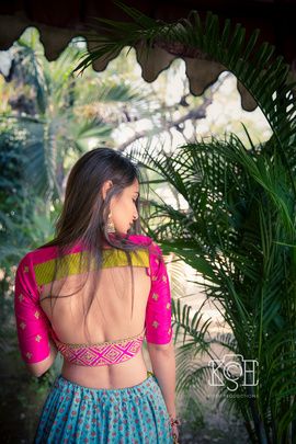 Indian Wedding Blouses - Manav & Parina | WedMeGood | Pink Backless Blouse with Green Detailing and Blue Lehenga #wedmegood #indianbride #indianwedding #backlesscholi #choli #blouse #lehenga #pink Trendy Wedding Colors, ब्लाउज बैक नेक डिजाइन, Blouse Ideas, Saree Bollywood, Backless Blouse Designs, Saree Designer, Blouse Back Neck Designs, Back Neck Designs, Backless Blouse