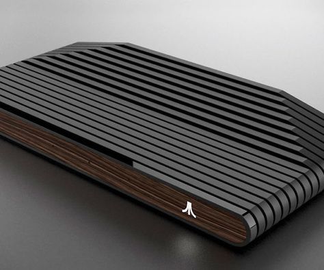 After a 25 year hiatus, the OG of console gaming is  back and releasing the Ataribox game system. Though specifics are unclear at the moment, it’ll feature a retro design inspired by the iconic Atari 2600 and but will include modern gaming hardware. Atari Console, Game Console Design, Super Nintendo Console, Arcade Console, Portable Game Console, Nes Console, Portable Console, Digital Board, Nintendo Console