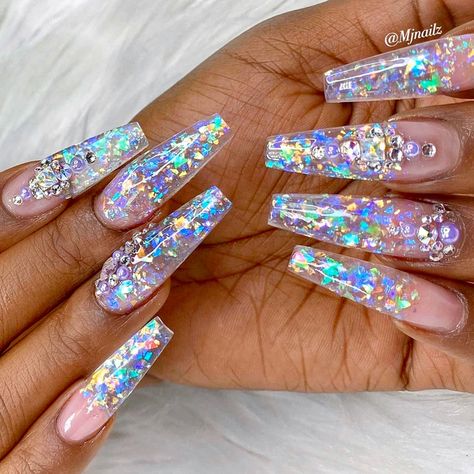 The more holo glitter on my nails, the better. I love sparkly coffin nails! ✨  #acrylicnails #hologlitter #nailinspo #naillooks #coffinnails #longnails #blingnails #blingbling #claws #nailsofinstagram #naildesigns Iridescent Acrylic Nails, Clear Sparkly Nails, Clear Glitter Acrylic Nails, Stiletto Nails Ombre, Sparkly Ombre Nails, Translucent Nails, Stilettos Nails, Clear Glitter Nails, Colourful Acrylic Nails