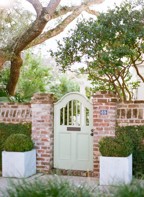 Ahh! The most gorgeous city on the coast of Carolina. As a Charleston SC Photographer I revel in every chance I get to be in this beautiful city. On a recent trip to Charleston, we meandered through the French Quarter and down Chalmers Street. Capturing some of the most quintessential things about Charleston, like the cobblestone streets, flower boxes under the windows, and horse-drawn carriage tours that you can spot throughout the city. Garden Gates And Fencing, Garden Gate Design, Brick Fence, Garden Entrance, The French Quarter, Front Gates, Outside Living, Patio And Garden, Entrance Gates