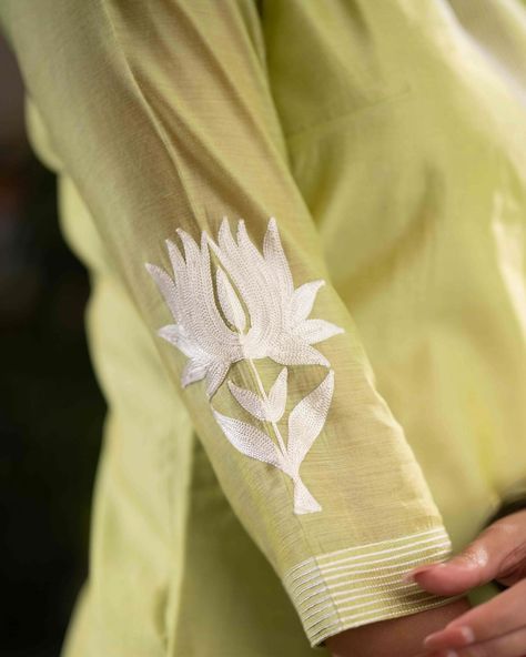 Indulge in effortless elegance with our Elegant Lemon Chanderi Pant & Kurta set. The delicate off-white lotus embroidery on the hemline and sleeves adds a touch of sophistication. Made from high-quality Chanderi fabric, this set is perfect for any occasion. Dupatta optional for versatility. #sujatra #sujatraglobal #sujatrakurtis #chanderikurta #chanderipants #kurtapantset #chanderi #embroidery #offwhiteembroideredsuits #lotusmotif #threadembroidery #festivewear Chanderi Kurta Set, Lotus Embroidery, White Lotus, Kurta With Pants, Effortless Elegance, Kurta Set, Festival Wear, Lotus, Embroidery Designs