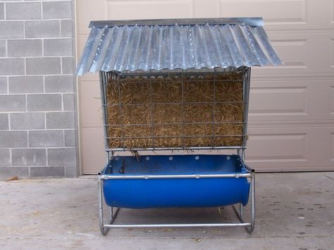 Goat feeder | Sheep and Goat Calf feeders for sale Sheep Grain Feeders Ideas, Covered Goat Feeder, Goat Feeders Grain, Goat Round Bale Hay Feeder, Hay Feeder For Sheep, Pallet Hay Feeder Goats, Sheep Feeders, Diy Goat Hay Feeder With Roof, Goat Hay Feeder