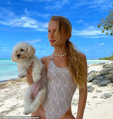 Sailor Brinkley-Cook shines in a one-piece swimsuit and cuddles with her mom's adorable dog Chester | Daily Mail Online Two Wolves, A Perfect Day, One Piece Suit, Dancing With The Stars, The Cross, Chester, Beach Style, Wolves, Beach Day