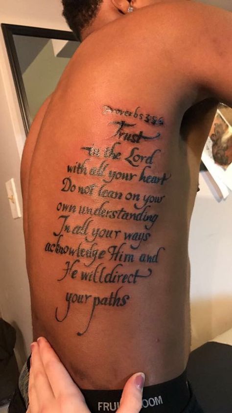 Shoulder Writing Tattoo Men, Scripture Tattoos For Men Shoulder, Rib Tattoos For Guys Quotes, Rib Script Tattoo, Side Tattoos For Men Ribs, Bible Scriptures Tattoos For Men, Men Rib Tattoo, Life Tattoos For Men, Chosen One Tattoo