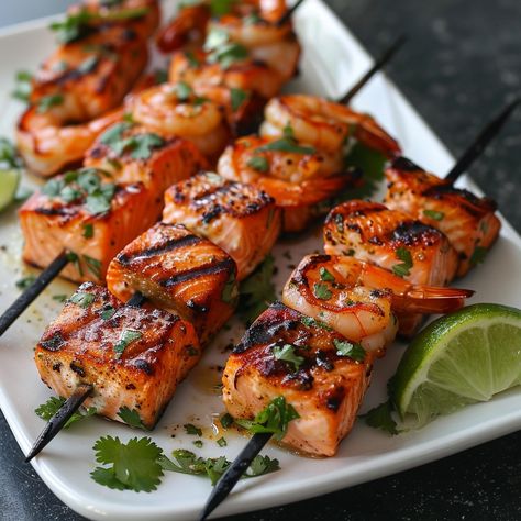 🌶️🍤 Try these zesty Chili Lime Salmon and Shrimp Skewers! 🍢✨ #ChiliLimeSkewers #SeafoodGrill Chili Lime Salmon and Shrimp Skewers Ingredients: Salmon fillets, cubed (1 lb) Shrimp, peeled and deveined (1 lb) Olive oil (2 tbsp) Lime juice (1/4 cup) Chili powder (1 tbsp) Garlic, minced (2 cloves) Salt and pepper (to taste) Fresh cilantro, chopped (1/4 cup) Skewers Instructions: In a bowl, mix olive oil, lime juice, chili powder, garlic, salt, and pepper. Marinate salmon and shrimp in the mix... Fish Skewers, Sweet Chili Sauce Recipe, Body Care Recipes, Breakfast Lunch Dinner, Pretty Food, Fish Recipes, Aesthetic Food, Tasty Dishes, I Love Food