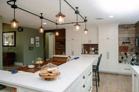 Chip and Joanna add warmth and rustic style to a modern ranch house, creating an ideal family home -- with room to grow -- for a couple with a young son and two recently adopted little girls. In this remodel Chip and the Gaines kids get a shot at being design consultantson the children's rooms, and the much-anticipated Joanna Gaines Light Fixtures, Track Lighting Ideas, Industrial Track Lighting, Rustic Track Lighting, Country Kitchen Lighting, Kitchen Lighting Over Table, Track Lighting Kitchen, Industrial Farmhouse Decor, Dining Table Lighting